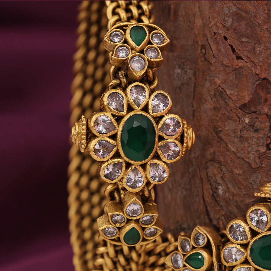 GOLD POLISHED FLORAL STONE BANGLE