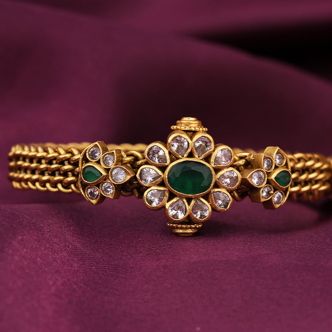 GOLD POLISHED FLORAL STONE BANGLE